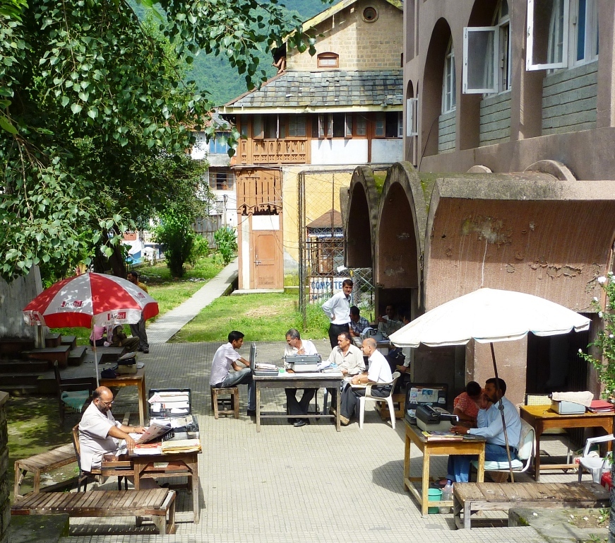 Modern scribes with typewriters outside post office, Mandi, Himachal Pradesh, India, 2010.