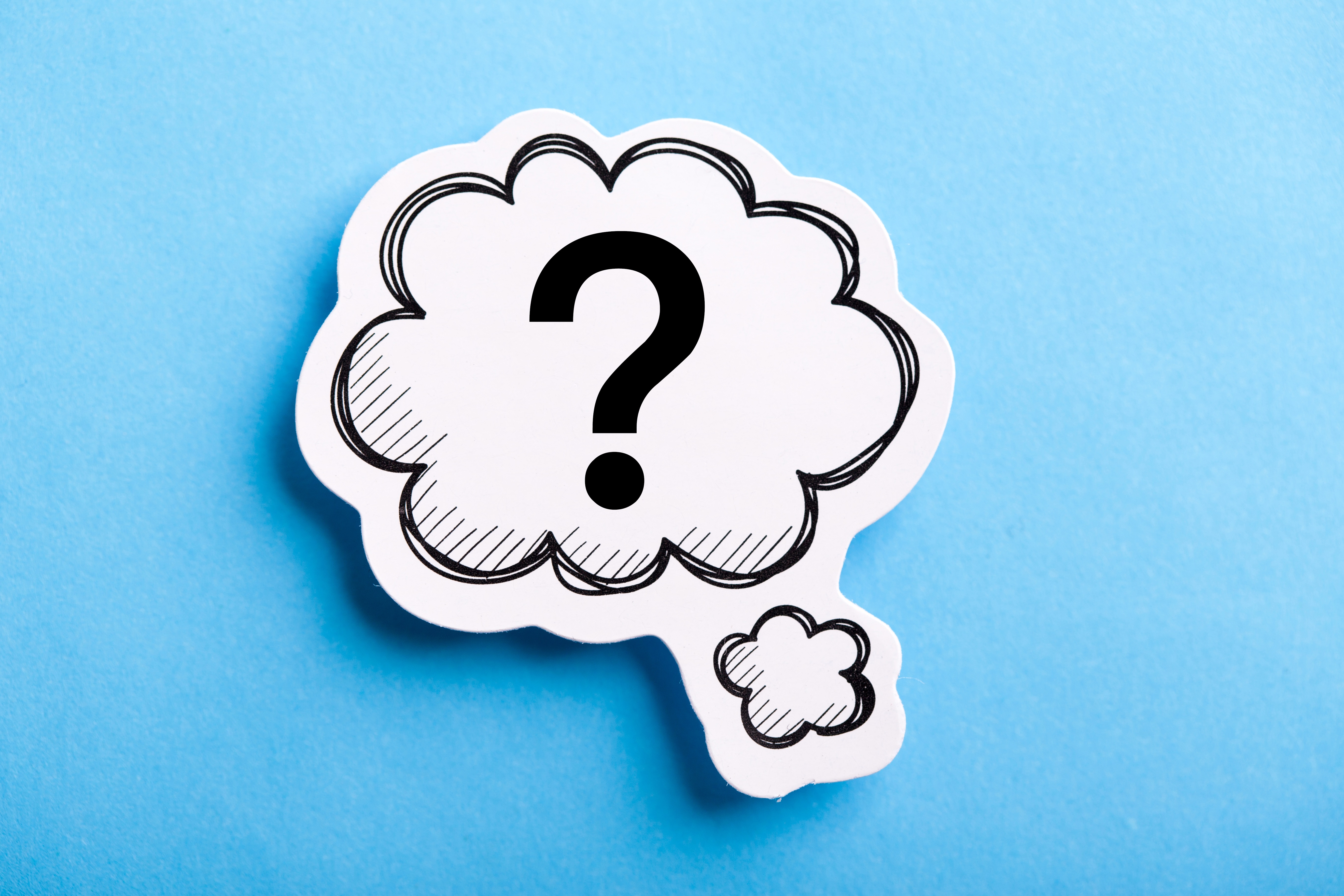 Question mark speech bubble isolated on blue background.