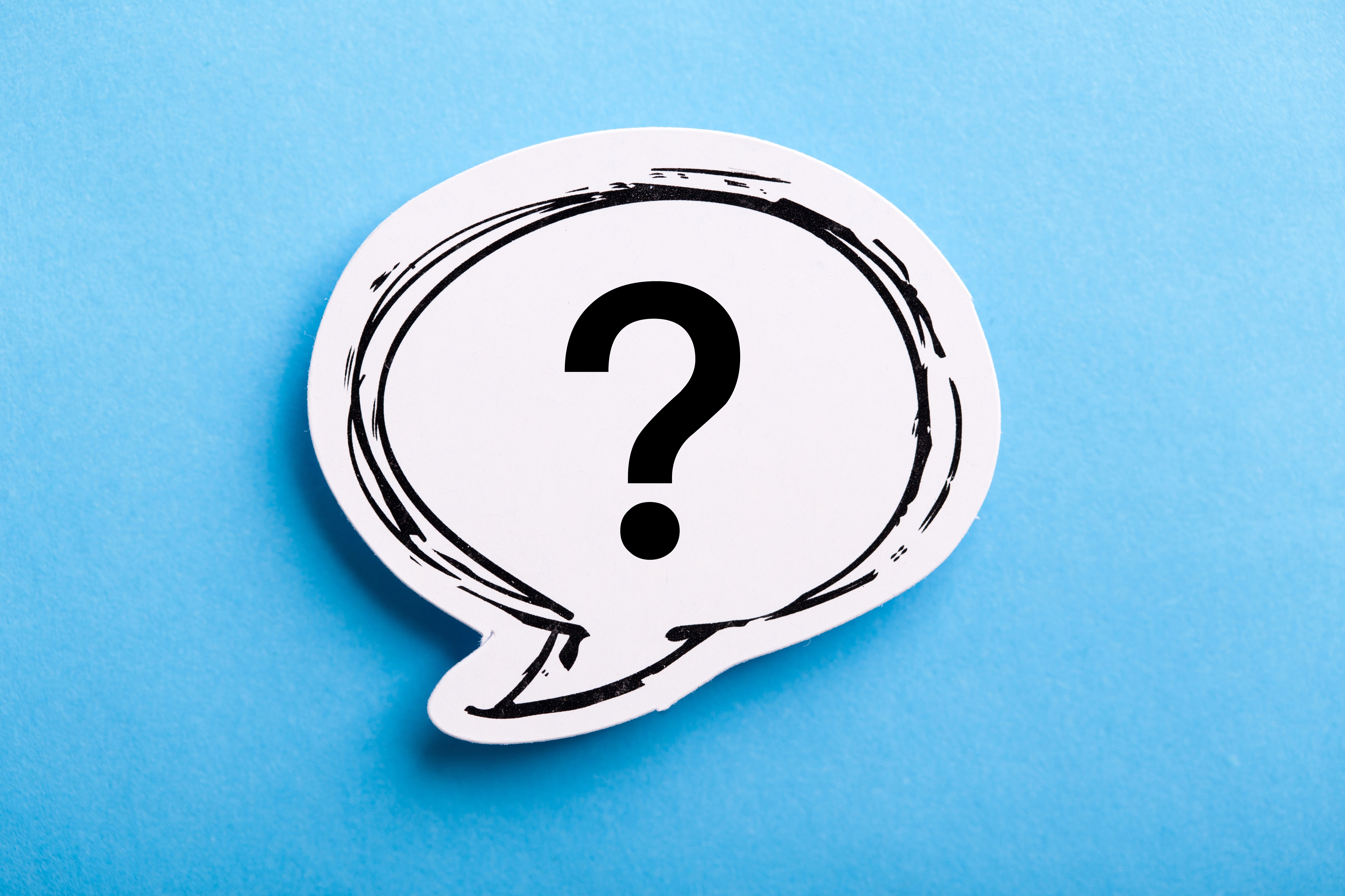 Question mark speech bubble isolated on blue background.