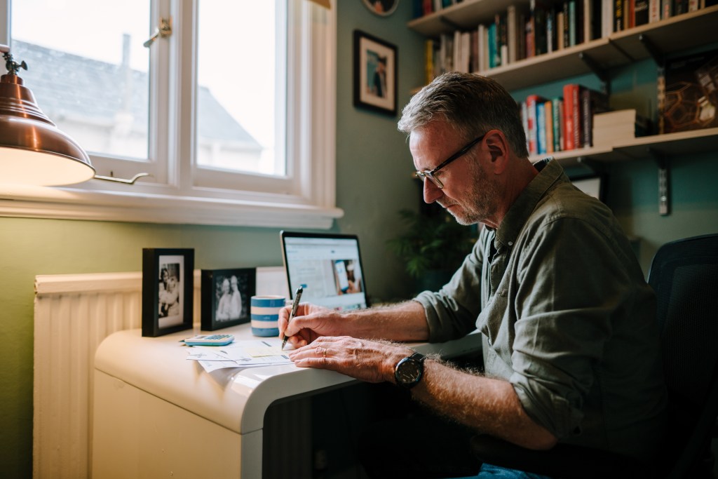 Man sat working at a computer.