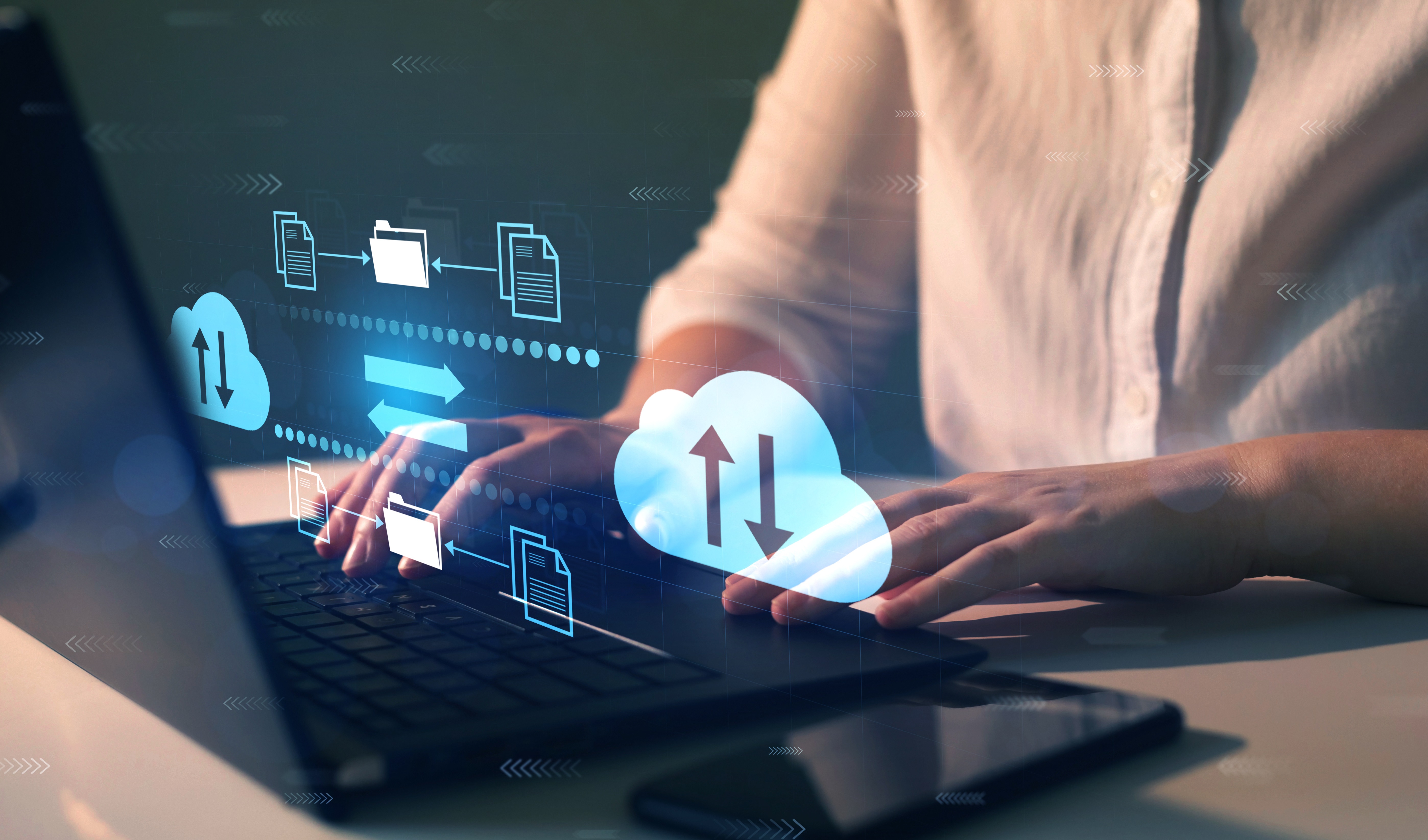 Woman backing up computer.